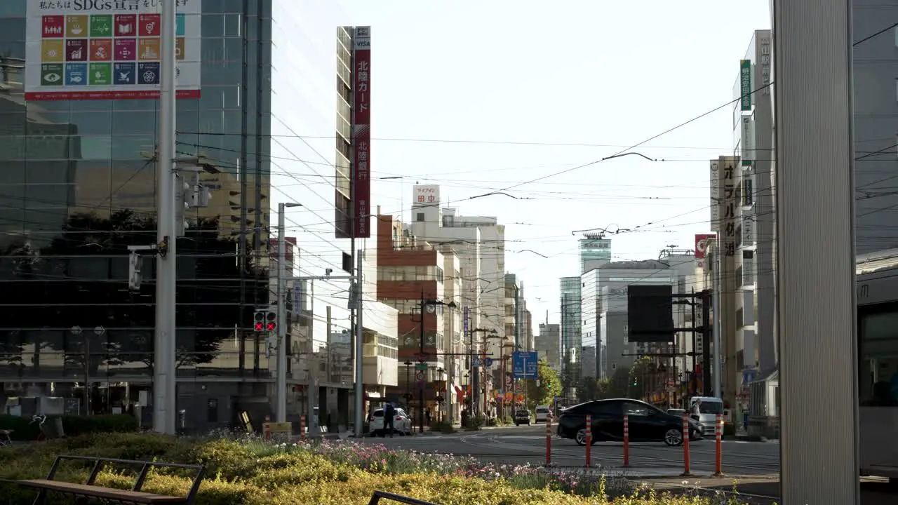 A daytime scene capturing a daily traffic at Toyama Station in Japan