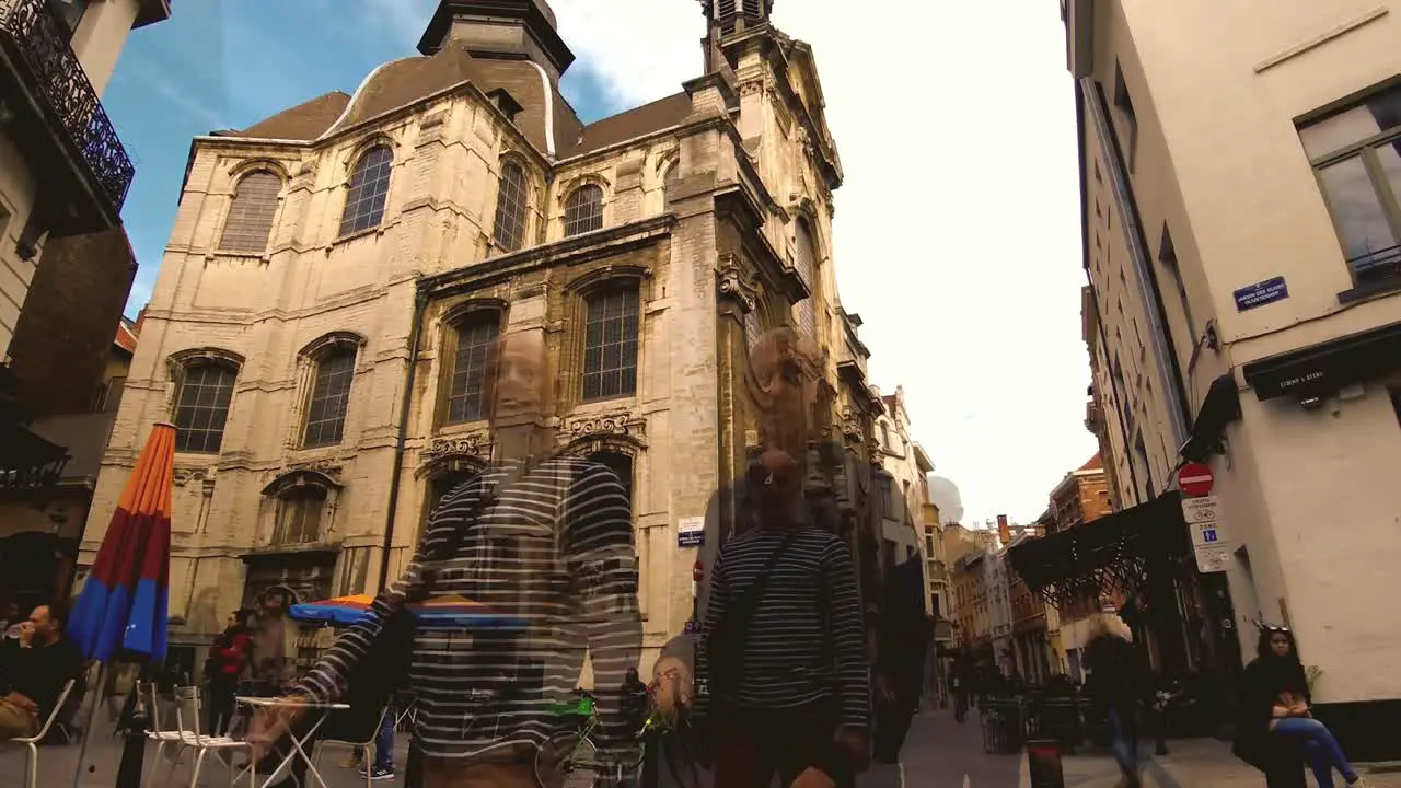 People walking and sitting at cafes pedestrian aerial Brussels  Belgium