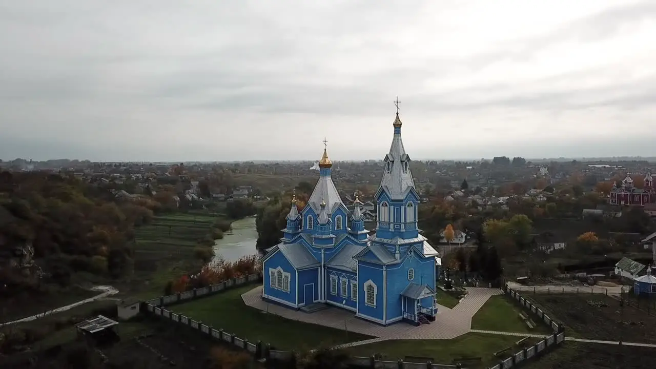 Drone view of a wooden blue church in Ukraine