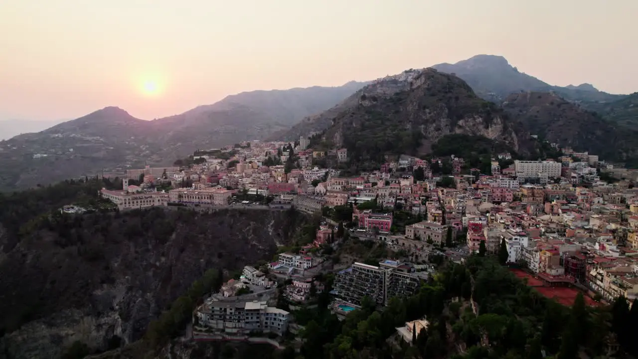 Aerial drone video over Taormina at sunset