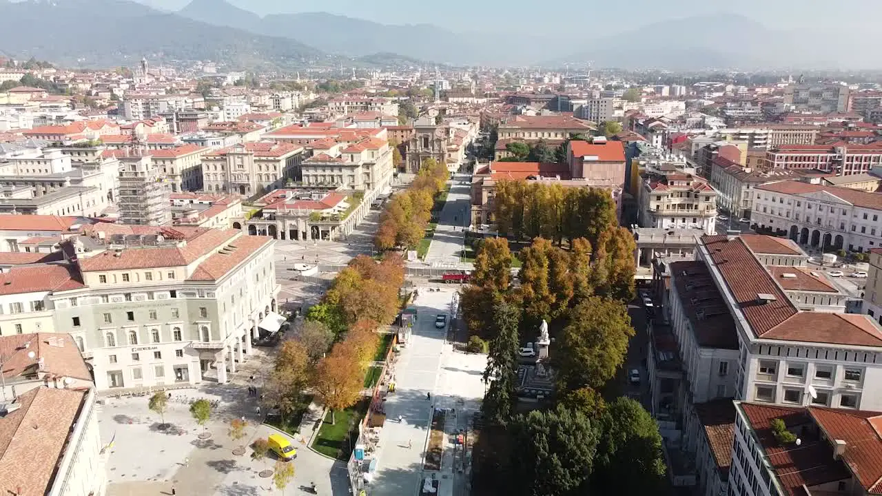 Bergamo city downtown and horizon aerial drone fly backward view