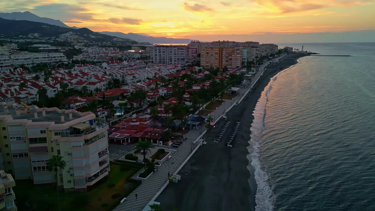 Aerial view of a coastal city being captures during the sunrise