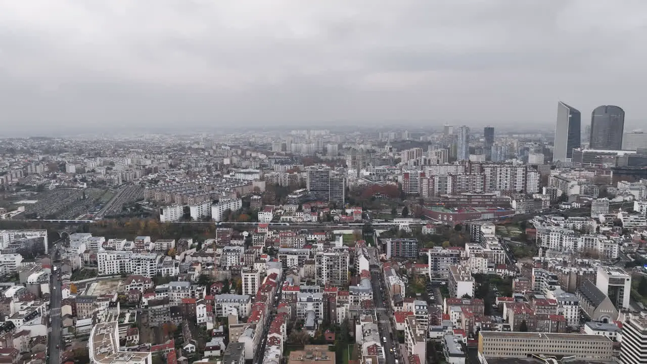 La Défense's skyscrapers rise through the mist on a cloudy day