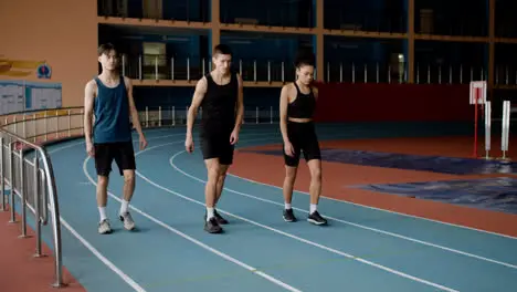 Young runners on running track