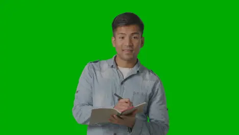 Male Teacher Talking To School University Or College Class In Lesson Against Green Screen 1