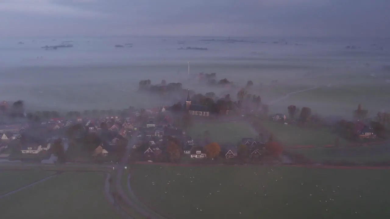 Burgum in Friesland Dutch countryside covered in morning mist aerial