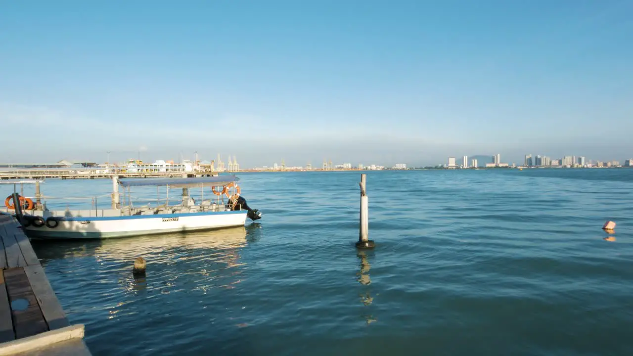 Beautiful Summer’s day off the coastline of a large cityscape in the distance