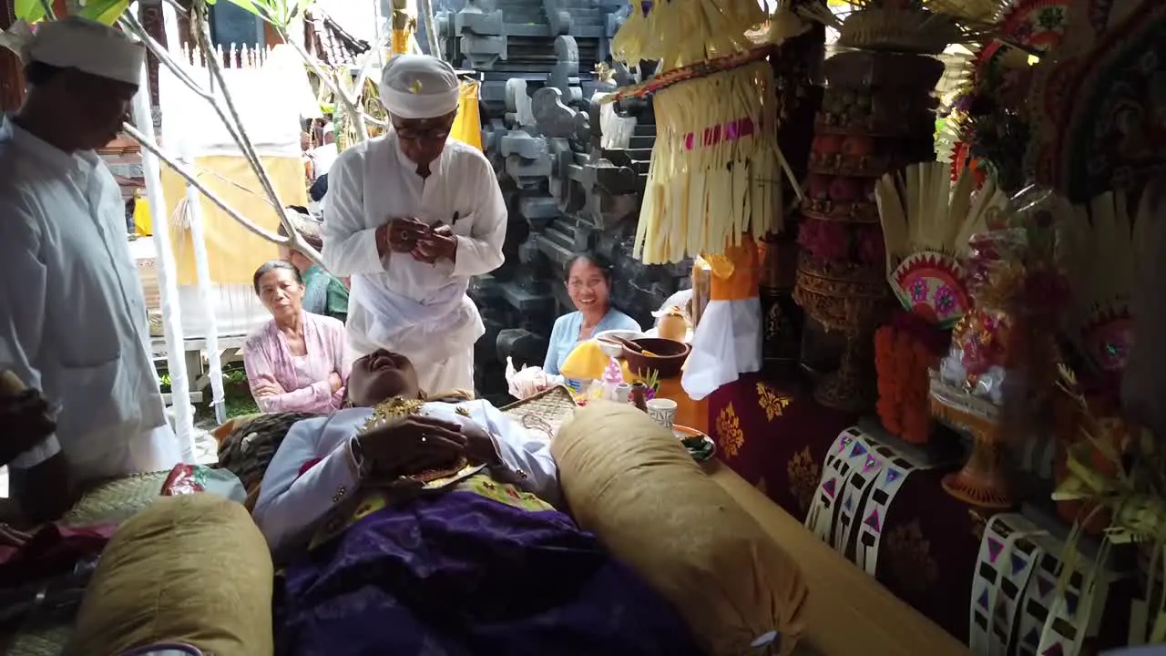 Traditional Tooth Filing Hindu Ceremony Bali Indonesia Priest Performs Religious Prayer and Ritual around Family in White Clothes