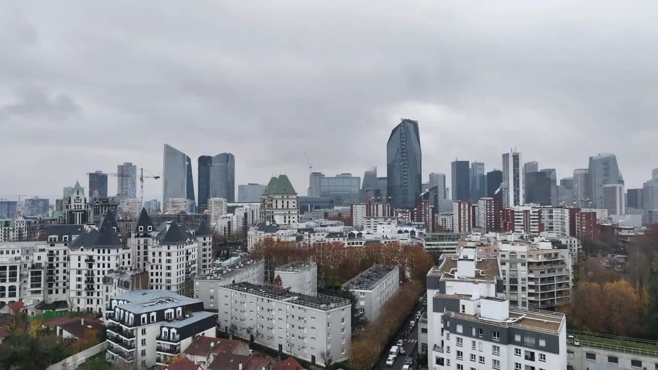 Clouds cast shadows over the sleek skyscrapers of La Défense