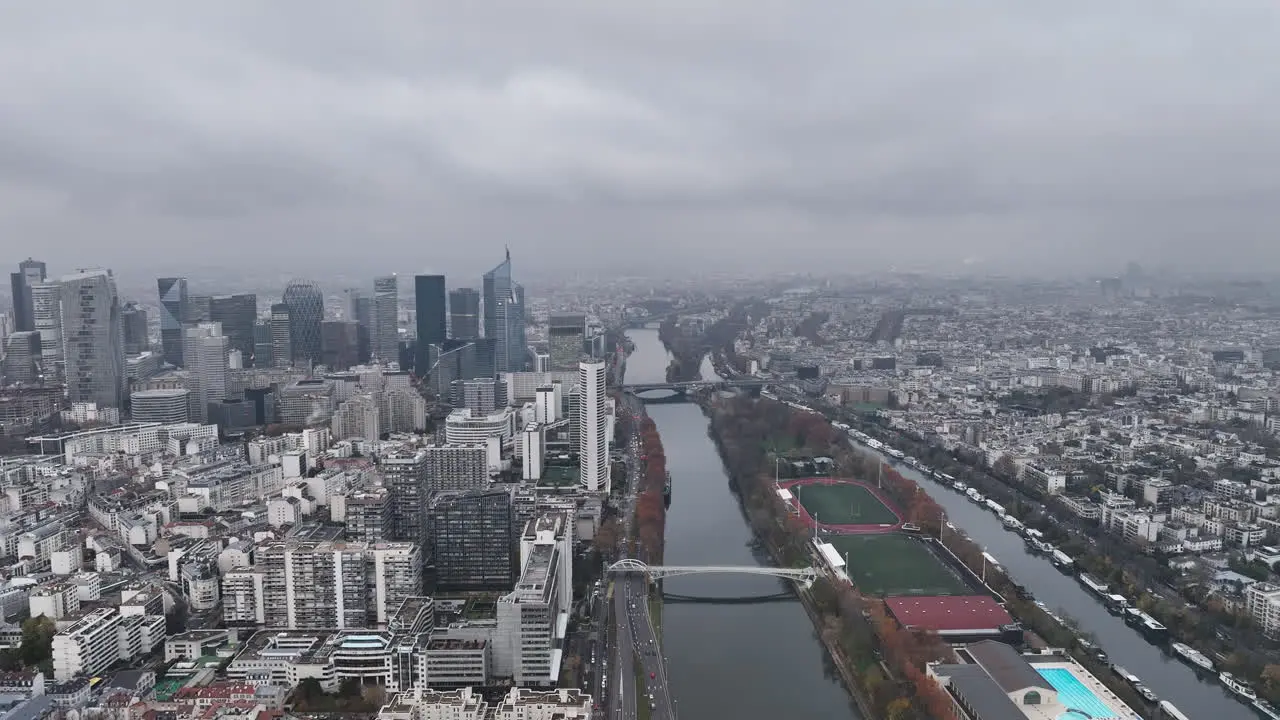 Aerial view of La Défense Paris's modern hub under a cloudy sky