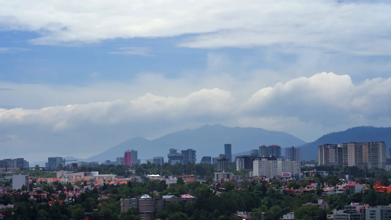 Timelapse of Clouds Passing Behind Mountains in City