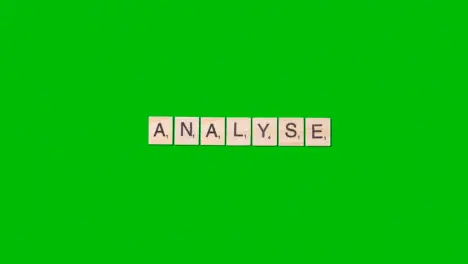 Stop Motion Business Concept Overhead Wooden Letter Tiles Forming Word Analyse On Green Screen 1