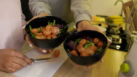 Woman holding salad bowls