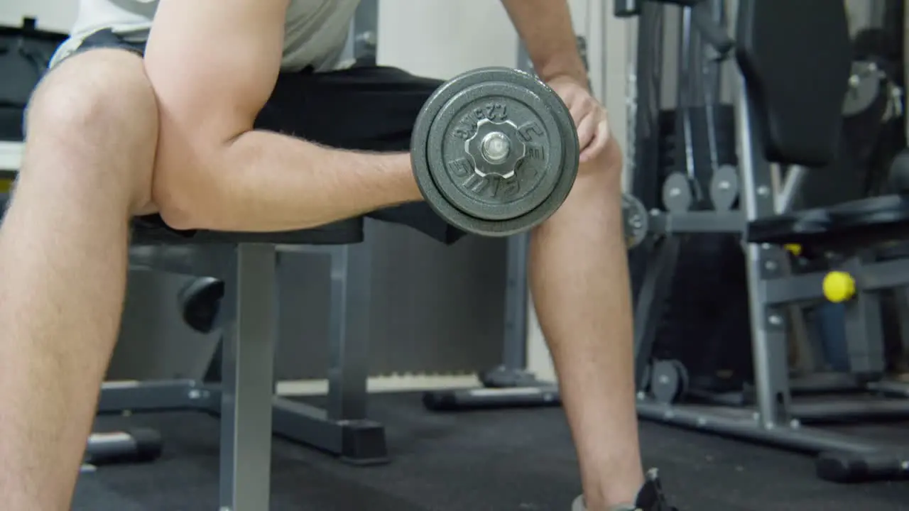 Close up on a man exercising with a dumbbell