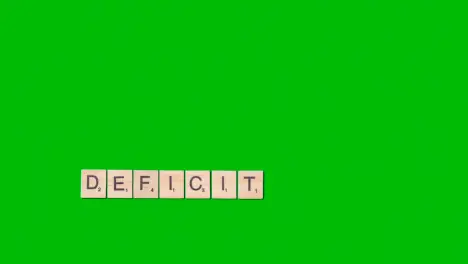 Stop Motion Business Concept Overhead Wooden Letter Tiles Forming Word Deficit On Green Screen 1