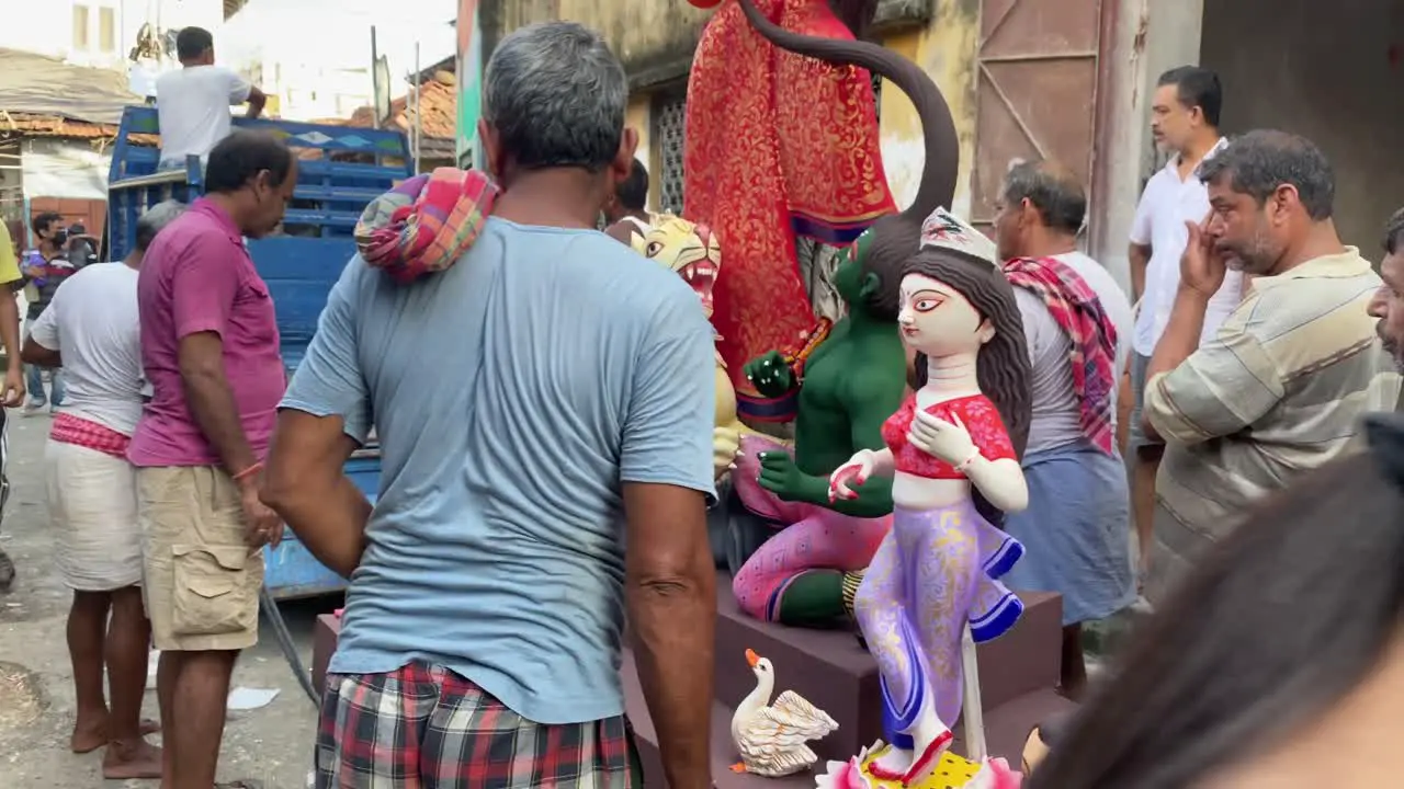 Local people picking Durga Maa Idols for transporting to local puja pandals during Durga Puja in Kolkata