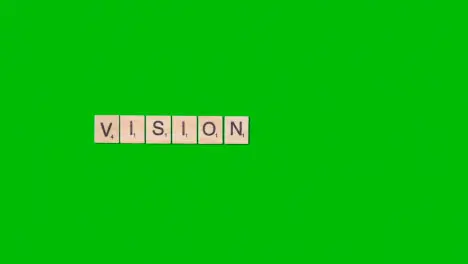 Stop Motion Business Concept Overhead Wooden Letter Tiles Forming Word Vision On Green Screen 1