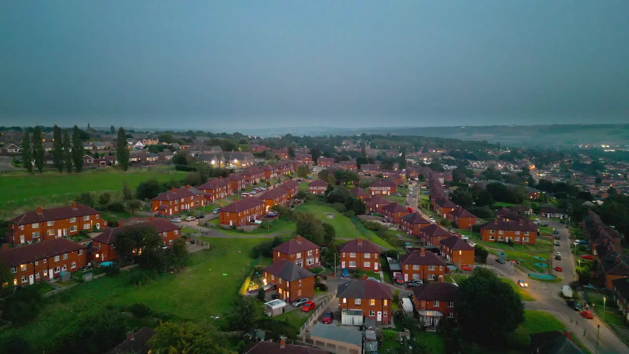 Explore the famed Dewsbury Moore Council estate in the UK through drone-captured video showcasing urban council-owned housing red-brick terraced homes and the industrial Yorkshire backdrop