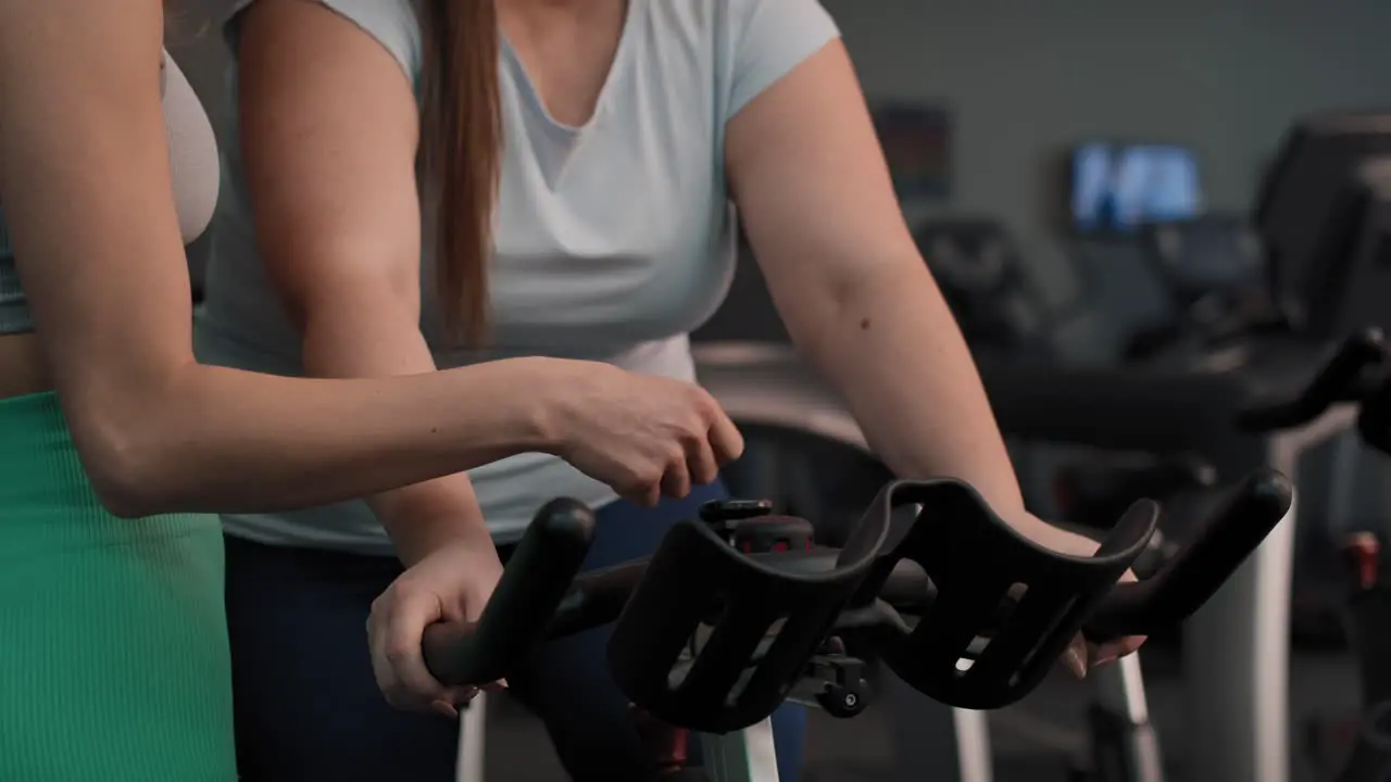 Close up of female trainer cooperate with overweight woman