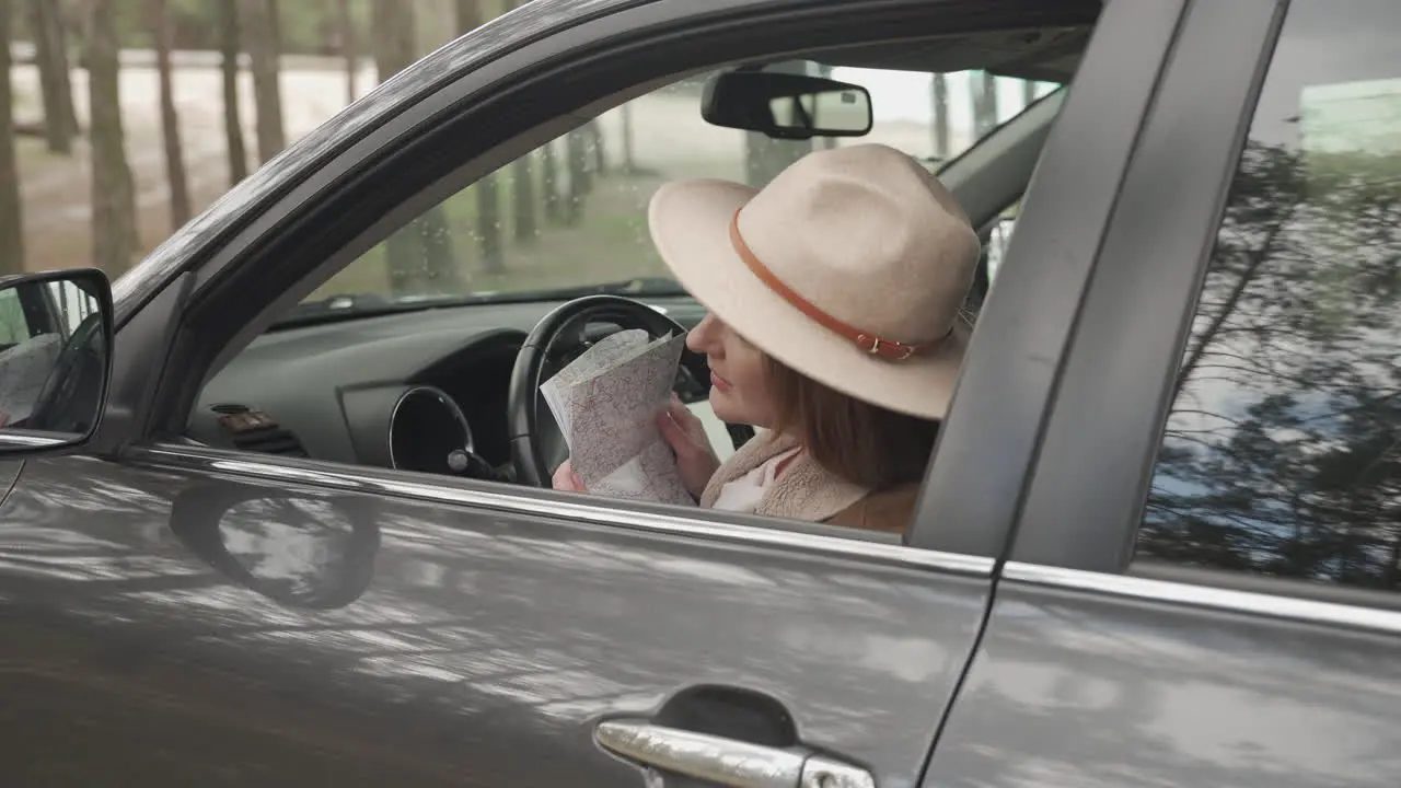 Red Haired Woman Is Lost With Her Car In The Middle Of The Countryside