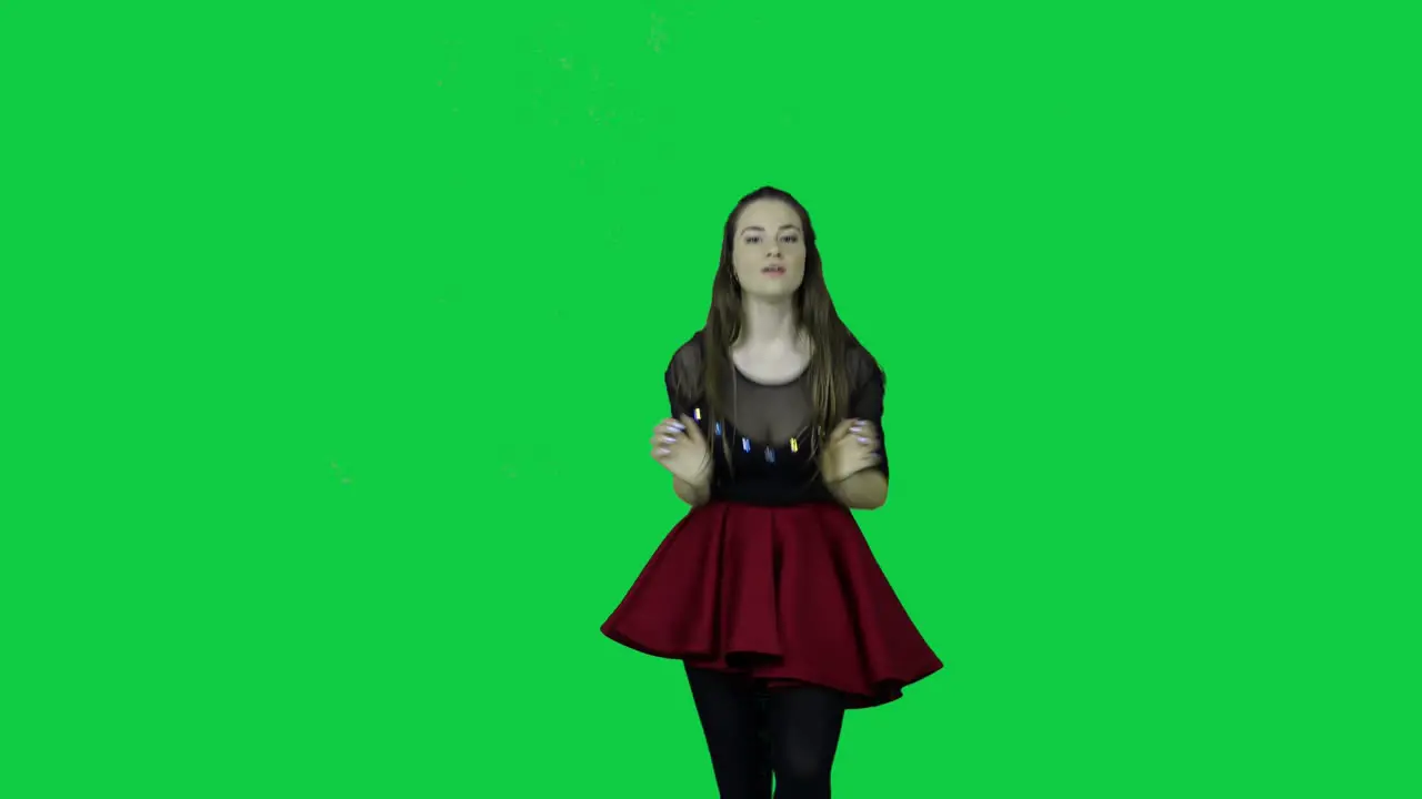 Close up to professional dancer energizing dancing in front of a green screen