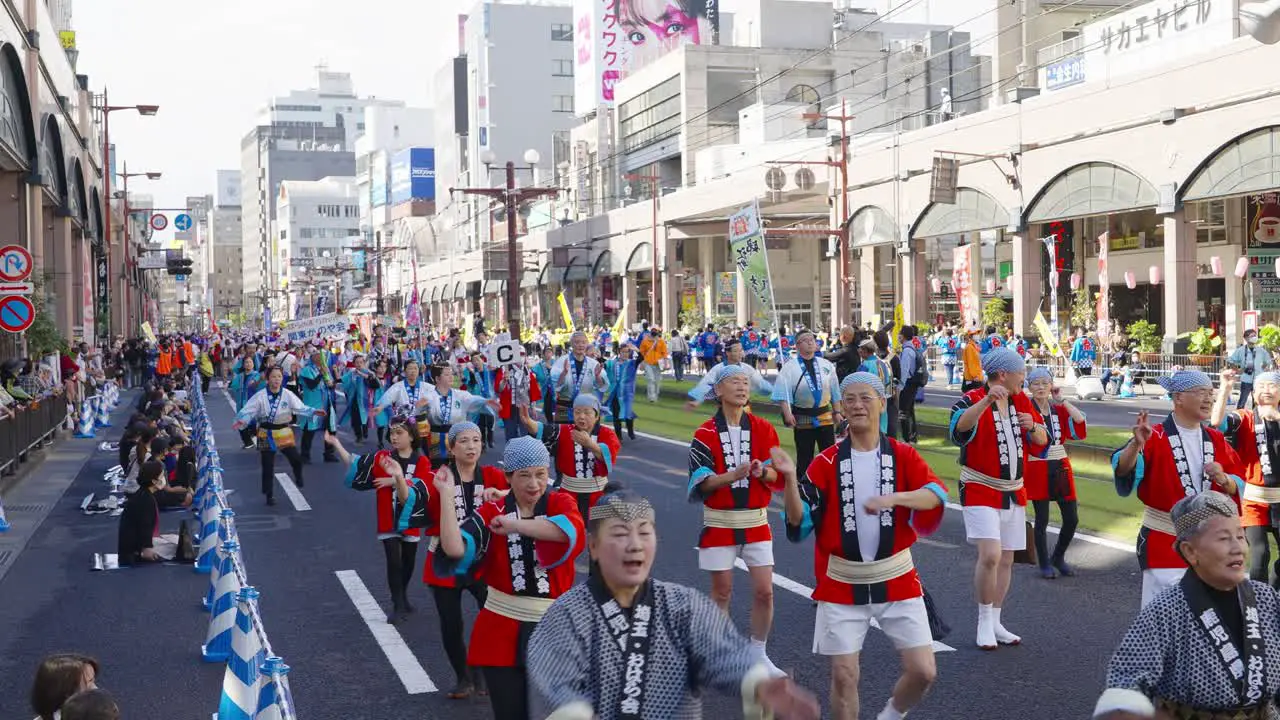 Hundreds of traditional dancers on street at Ohara Festival downtown Kagoshima