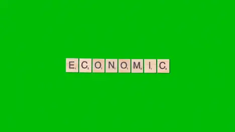 Stop Motion Business Concept Overhead Wooden Letter Tiles Forming Word Economic On Green Screen 1