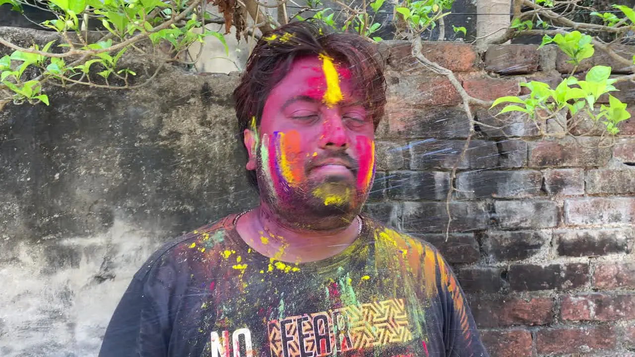 Man celebrating Holi in India