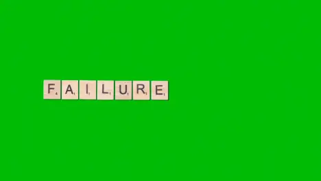 Stop Motion Business Concept Overhead Wooden Letter Tiles Forming Word Failure On Green Screen 1