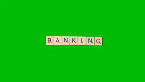 Stop Motion Business Concept Overhead Wooden Letter Tiles Forming Word Banking On Green Screen 1