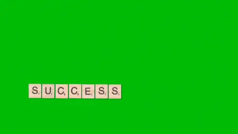 Stop Motion Business Concept Overhead Wooden Letter Tiles Forming Word Success On Green Screen 1