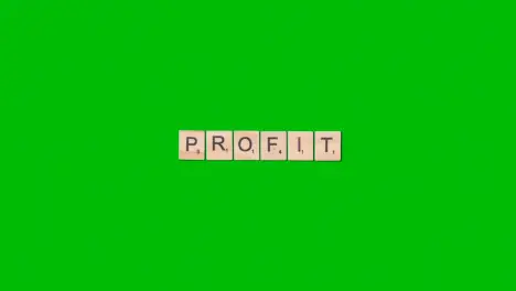 Stop Motion Business Concept Overhead Wooden Letter Tiles Forming Word Profit On Green Screen 1