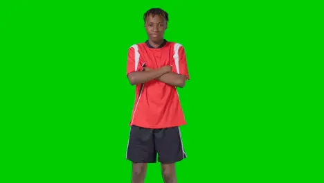 Studio Portrait Of Young Male Footballer Wearing Club Kit Against Green Screen 1