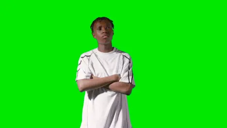 Studio Portrait Of Young Male Footballer Or Sportsperson Wearing Club Kit Against Green Screen 3