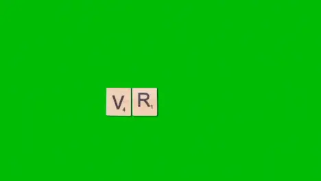 Stop Motion Business Concept Overhead Shot Wooden Letter Tiles Forming Acronym VR On Green Screen