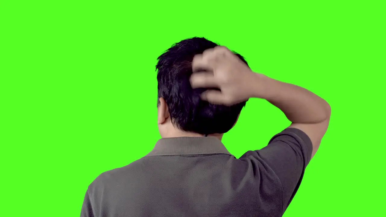 Balding man with an itchy and irritable scalp can't stop scratching his head clean and keyable green screen so you can add your background