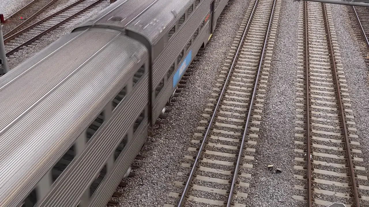 overhead shot of passenger train in rail yard 4k