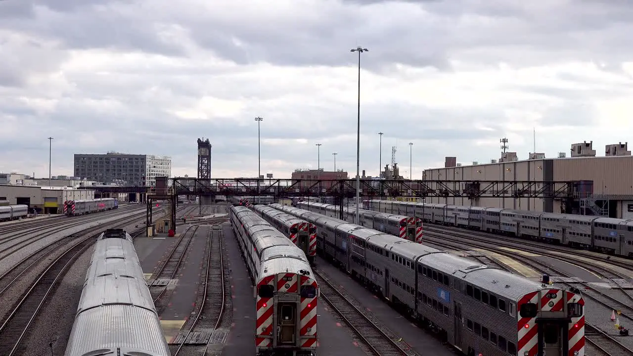 passenger train leaving rail yard overhead view 4k