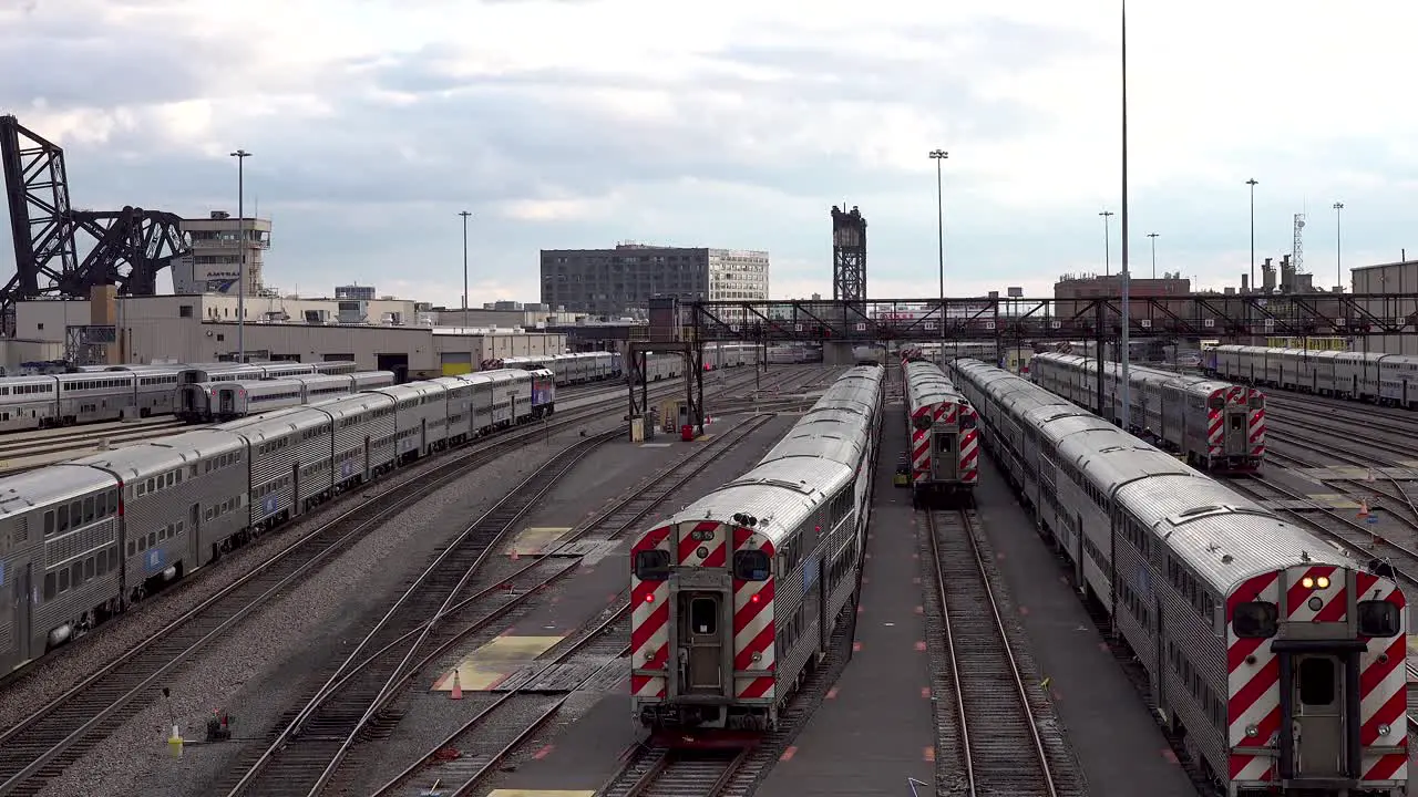 a passenger train traveling through rail yard hub 4k