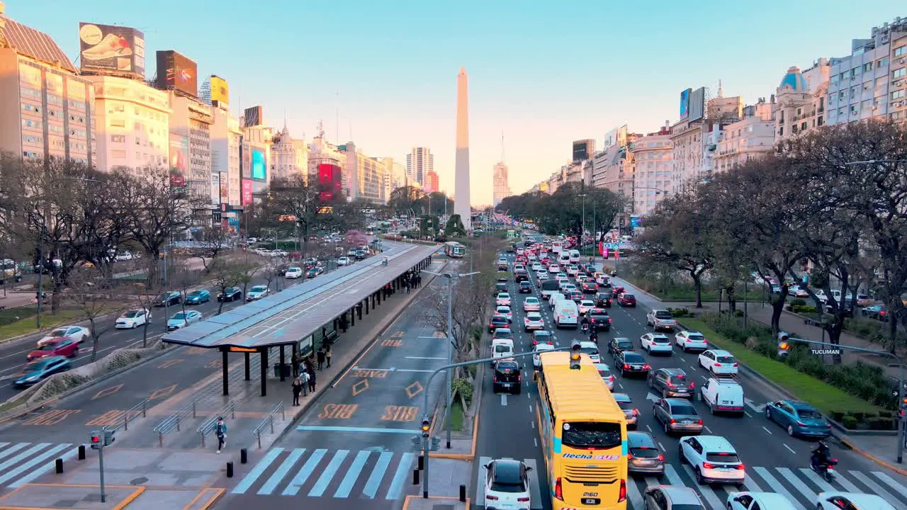 Traffic along downtown Buenos Aires stretching towards the Obelisk Static Wide Shot