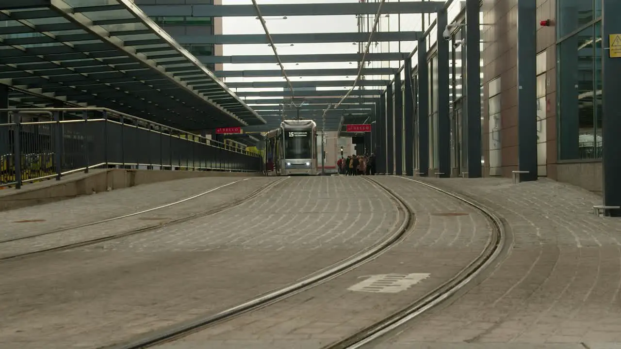 Zero emission electric transit train on quiet cobbled Helsinki street