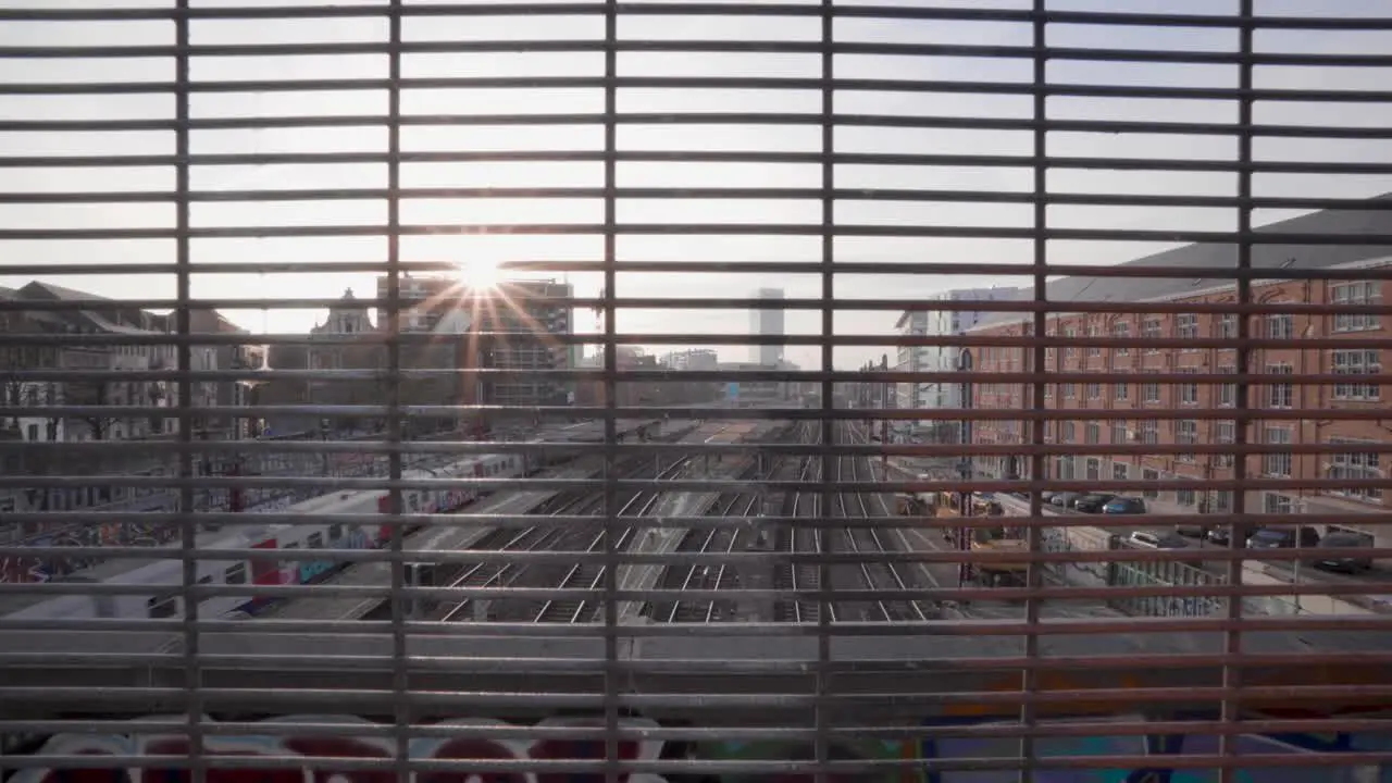 Wide skyline view of passing train at station Brussel-Kapellekerk in Brussels Belgium