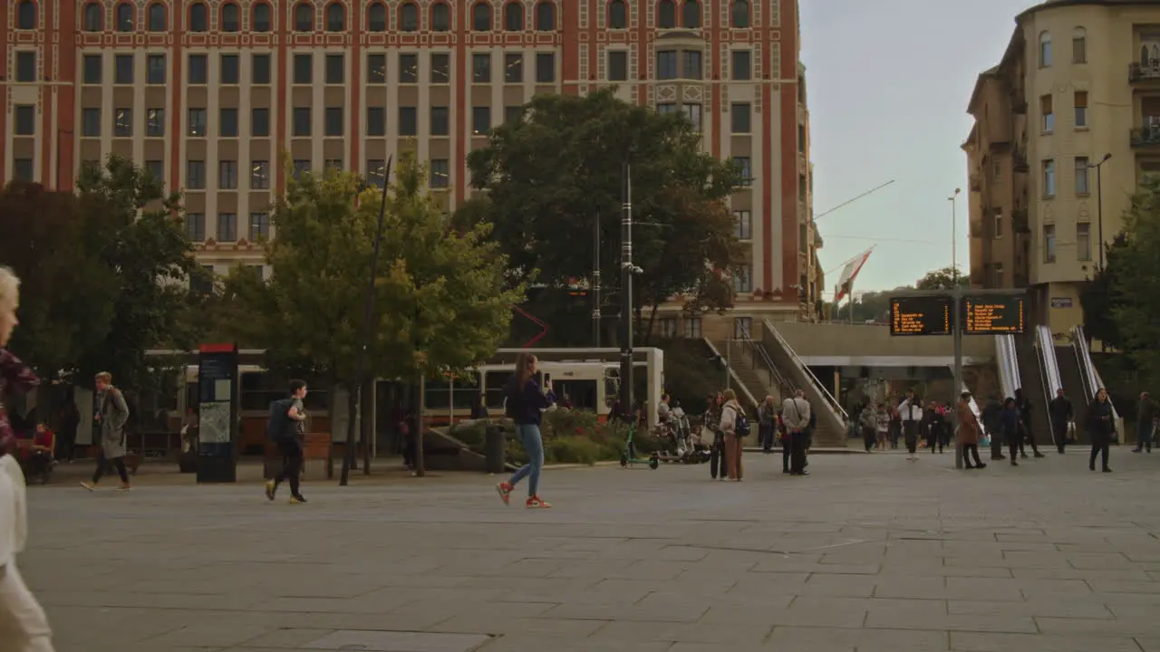 People are walking on Szell Kalman Square