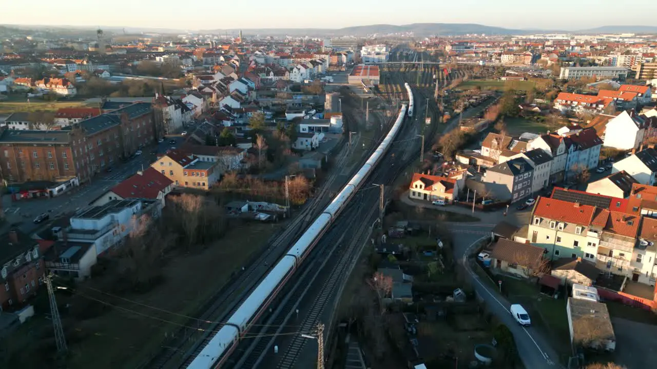 Drone Video of two ICE Trains crossing their way during sunset in Bamberg