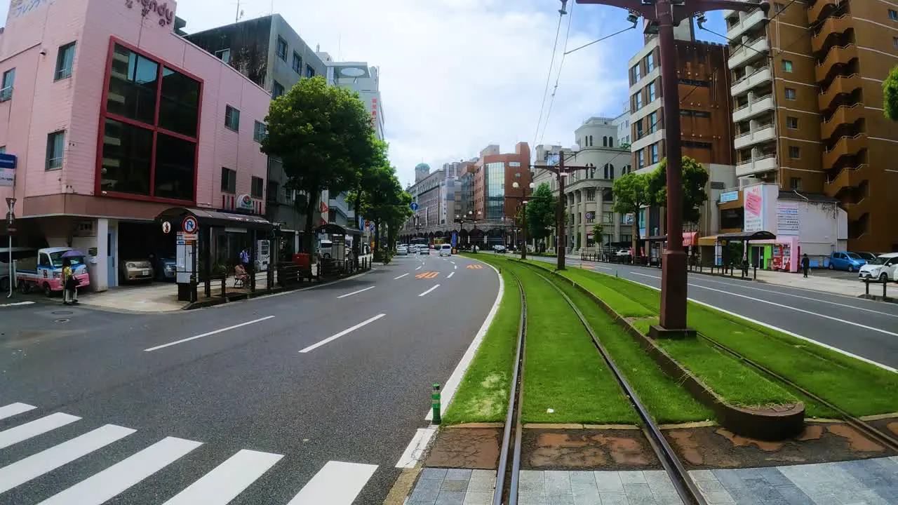 Point of view shot of public tram moving leisurely through Kagoshima Japan