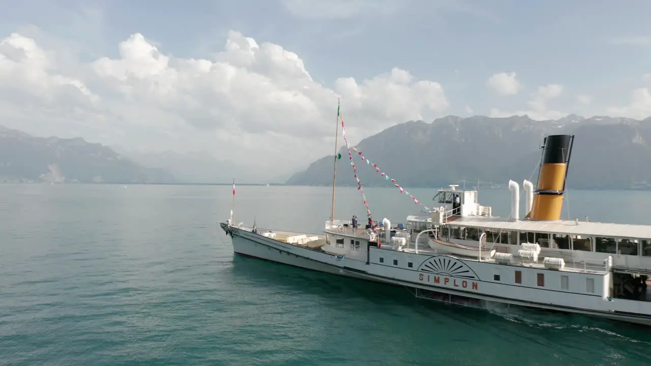 Jib down of a beautiful old cruise ship sailing on lake Geneva