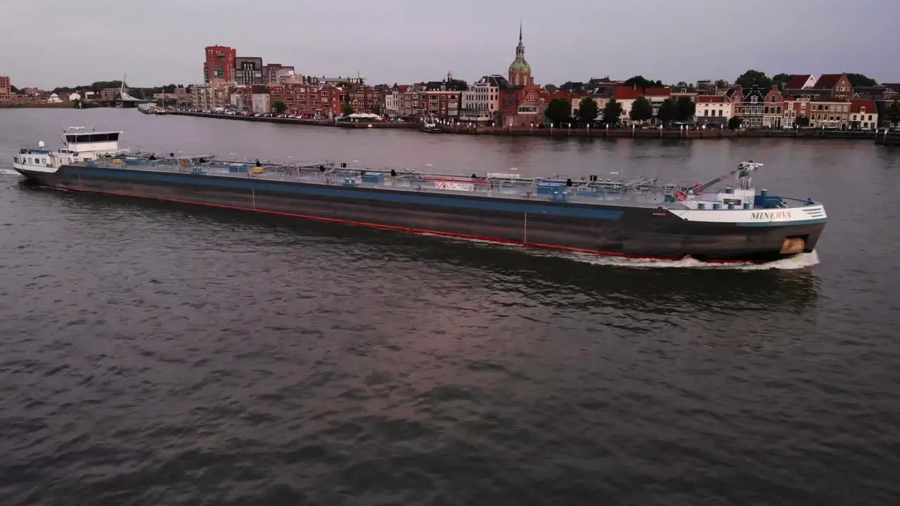 Sideway tracking of tanker passing around buildings in city