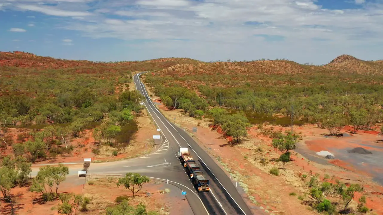 Three-trailer Road Train In The Australian Outback Road On A Sunny Day In QLD Australia