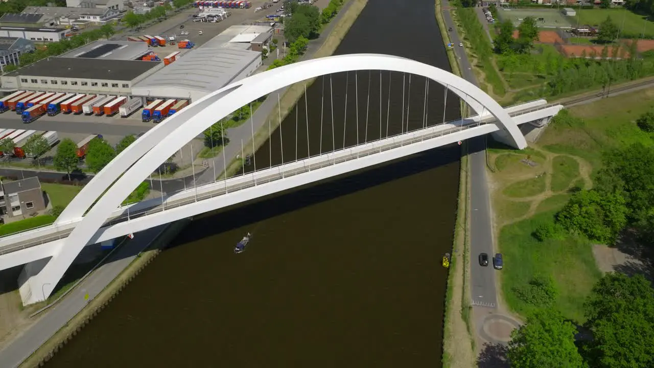 Modern White 'Bert Swart' Arch Train Bridge with Boat Passing Underneath It Zuidhorn Groningen Netherlands