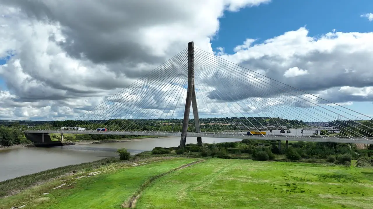 Establishing shot of a toll bridge over the river Suir in Waterford Ireland on a warm sunny day